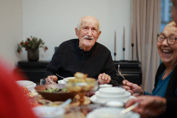 istock Senior Couple Enjoying Dinner Together 2205580769