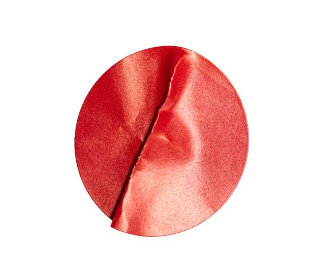 istock Crumpled red round sticker paper blank with transparent background, creating a textured and vibrant visual element cutout 2205581745