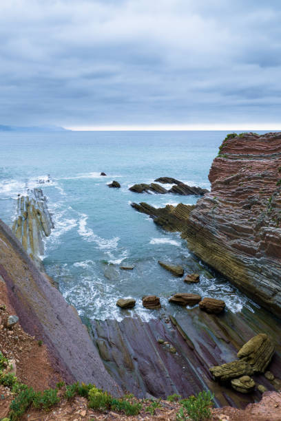 istock A dramatic coastal scene from the north of Spain, featuring striking layered rock formations. 2205582233