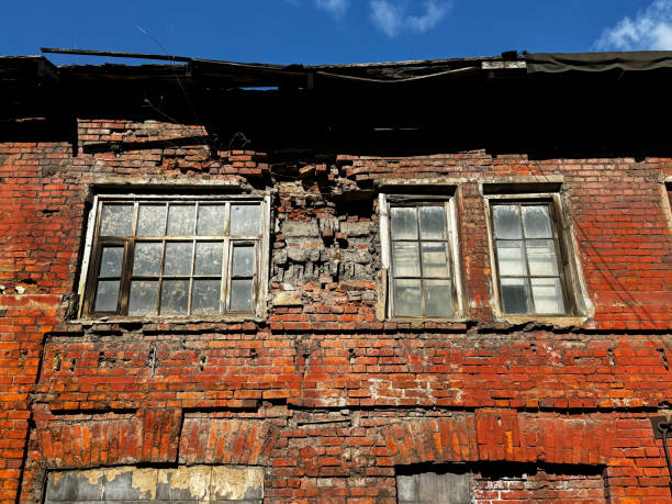 istock Brick old exterior wall of abandoned house 2205584321