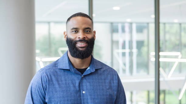 istock Confident African American Man Smiling in Modern Office 2205584543