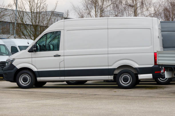 istock Parked white van with blank side, space for design, transport truck mock-up 2205586672