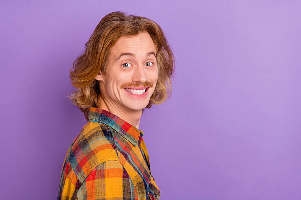 istock Profile side view portrait of attractive cheerful funky guy copy blank space ad isolated over bright violet purple color background 2205587027