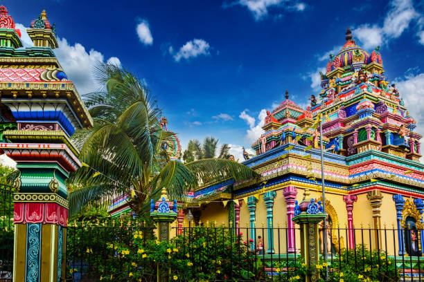 A small Hindu temple against a blue sky.