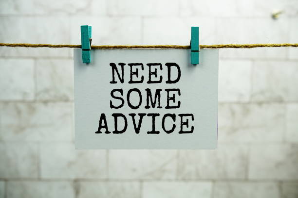 istock Need some Advice text on paper card hanging on the wall with Clothespins 2205587645