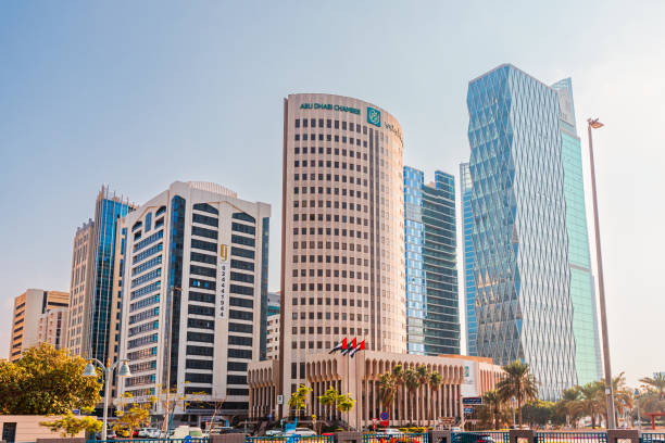 16 January 2025, Abu Dhabi, UAE: Modern skyscrapers rising above the skyline, featuring the Chamber of Commerce building, a prominent landmark in the city's business district