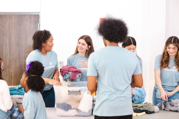 istock Volunteers sorting donations at a charity event 2205590322
