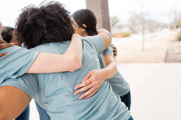 istock Multiracial women hugging, showing togetherness and support 2205590338