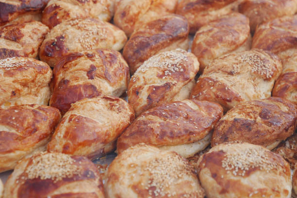 Goldenbrown pastries topped with sesame seeds, perfect for any casual or festive occasion