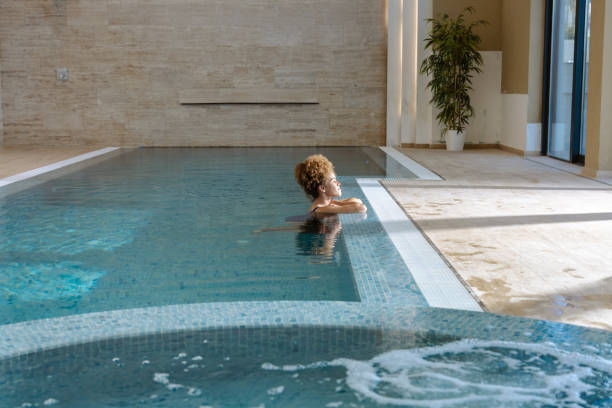 istock Relaxing by the poolside in a peaceful indoor setting with natural light 2205594057
