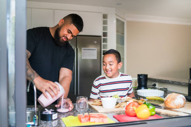 istock Dad and son blended the perfect smoothie for wellness. 2205594643