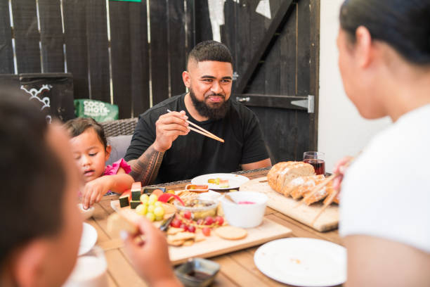 istock Family making moments over a shared meal. 2205594861