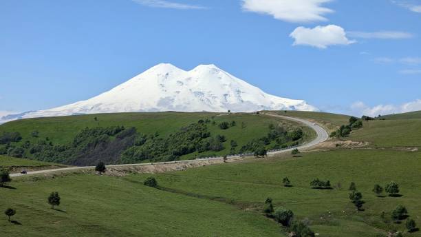 istock A Majestic SnowCapped Mountain Towering Under a Clear Blue Sky with Beautiful Scenery 2205596920