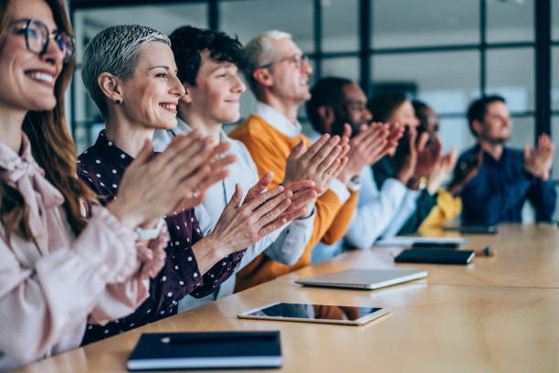 istock Businesspeople applauding during a seminar in conference hall. 2205598288