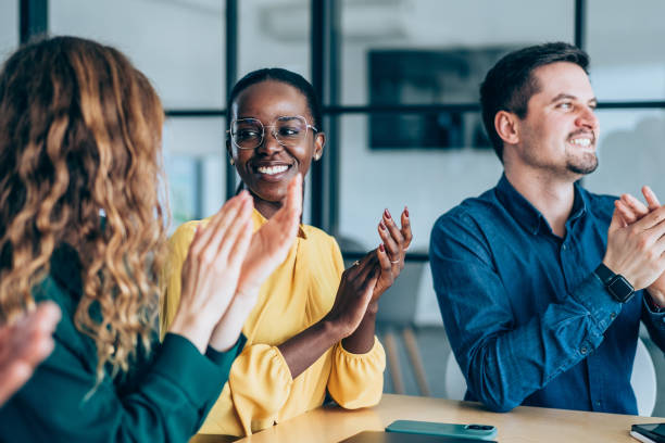 istock Businesspeople applauding during a seminar in conference hall. 2205598320