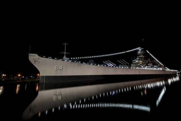Norfolk, Virginia, USA - February 14, 2025: Calm water surrounds the USS Wisconsin, commissioned in 1944, served in World War Two, Korea, and the Gulf War; now at the Nauticas Museum.