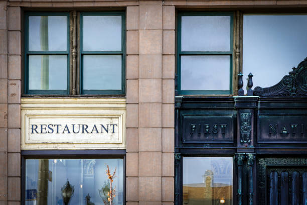 Manitowoc, Wisconsin, USA - January 11, 2025: A restaurant and apartments now occupy the old Manitowoc First National Bank built in 1927.