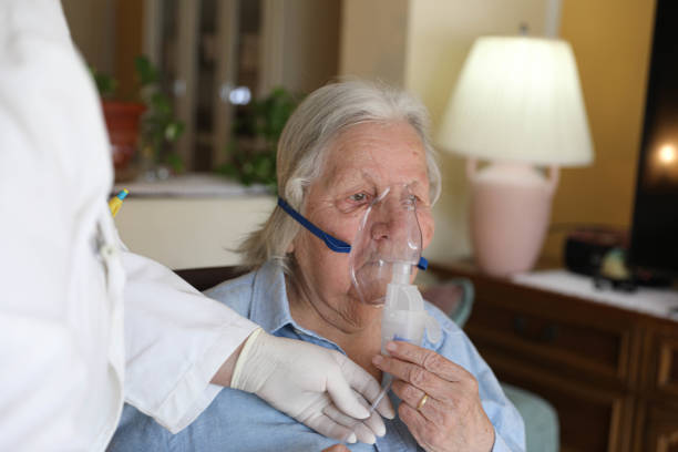 istock Elderly Woman Undergoing Oxygen Therapy at Home 2205599698