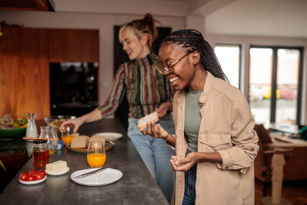 istock Friends Enjoying Breakfast in a Bright Kitchen 2205601220