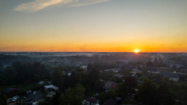 istock countryside at sunset. smoke from holiday fires is visible everywhere 2205602061