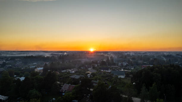 istock countryside at sunset. smoke from holiday fires is visible everywhere 2205602065