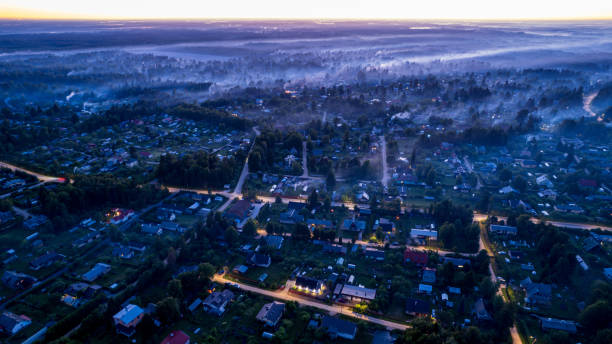 istock countryside at sunset. smoke from holiday fires is visible everywhere 2205602101