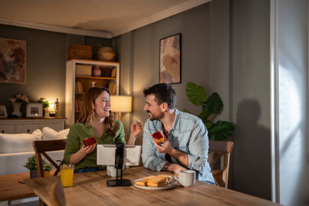 istock Couple eating waffles and making a video call at home 2205602552