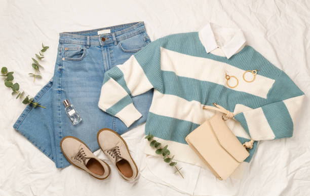 istock Flat lay with women's trendy spring outfit on white sheet background, top view 2205603883