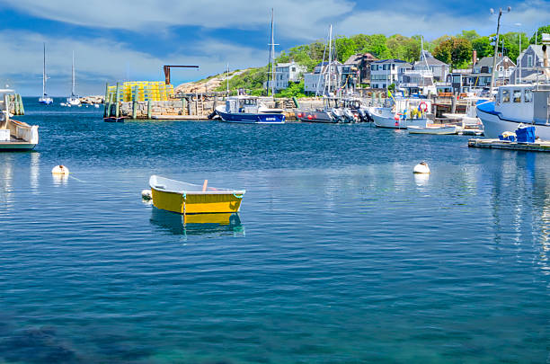 istock The Yellow Dinghy in Rockport Massachusetts Harbor 2205604115