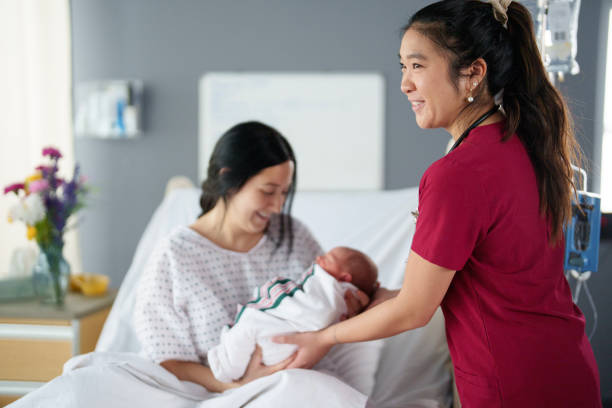 istock Women Supporting Women in Childbirth 2205605200