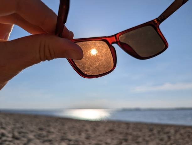 istock Sunglasses Reflecting Bright Sunlight While You Enjoy Your Time at the Beautiful Beach 2205606175