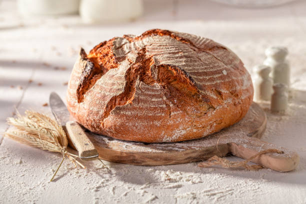 istock Hot and fresh round loaf bread baked from yeast. 2205609136