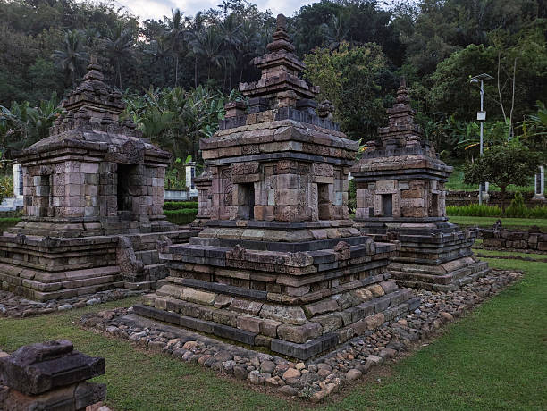 istock Ancient Stone Structure of Ngempon Temple in Lush Forest Landscape 2205609308