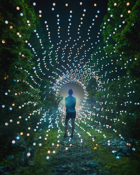 istock Young woman standing in mysterious forest at night 2205611598