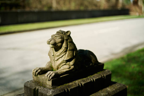 Yuzhno-Sakhalinsk, Russia - August 05, 2022: traditional Japanese statue of a stone lion at the entrance to the Sakhalin Museum of Local Lore