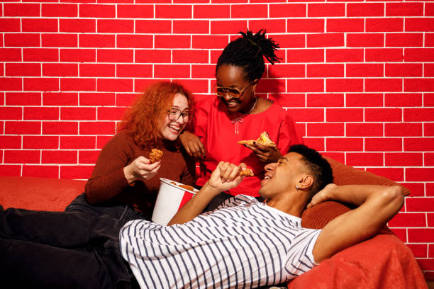 istock Friends Enjoying Fast Food Together 2205615863