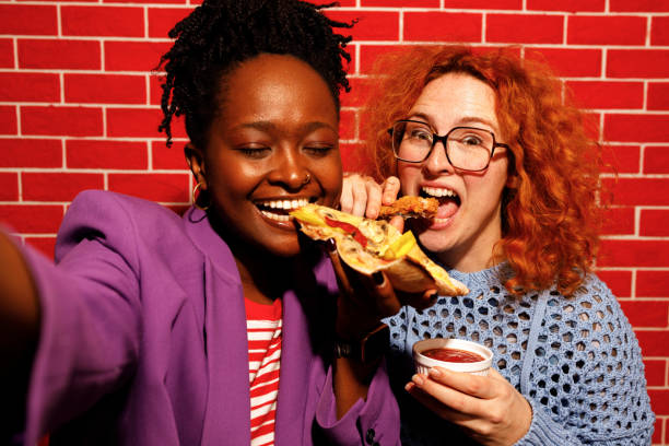 istock Friends Taking a Selfie While Enjoying Fast Food 2205615881