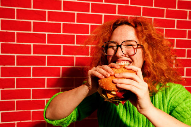 istock Enjoying a Juicy Burger 2205615911