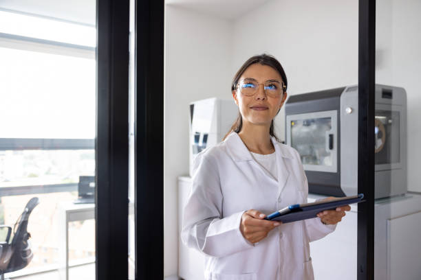 istock Woman working at a 3D printing lab and holding a digital tablet 2205617510