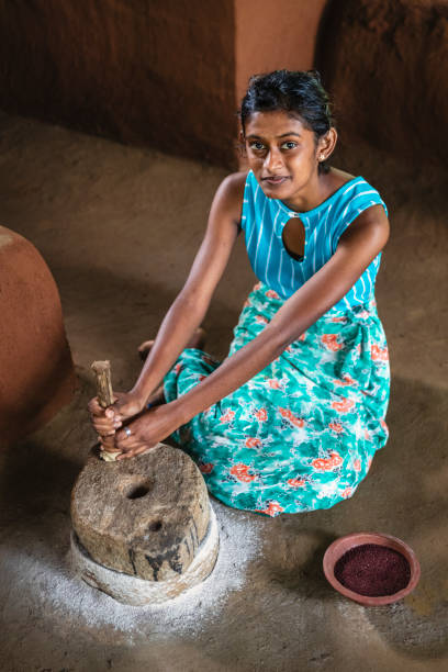 istock Sri Lankan woman grinding a grain 2205617717