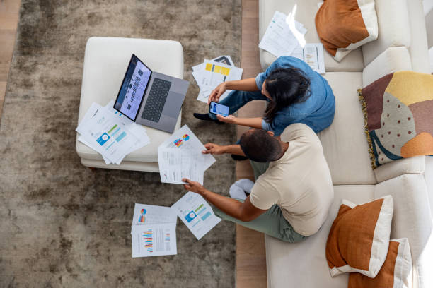 istock Couple working at home in their e-commerce business 2205619869