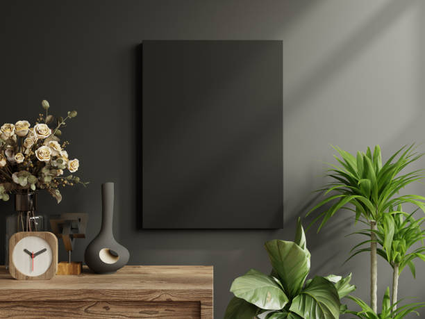 istock Mockup poster frame on cabinet in living room interior on empty dark wall background- 3D rendering 2205626424