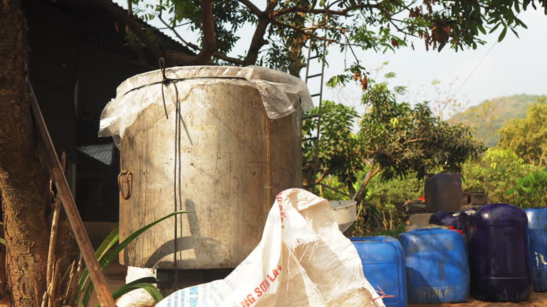 Large stainless steel honey extractor at traditional bee farm in Mộc Châu, Vietnam, essential equipment for sustainable honey production, beekeeping and organic farming.