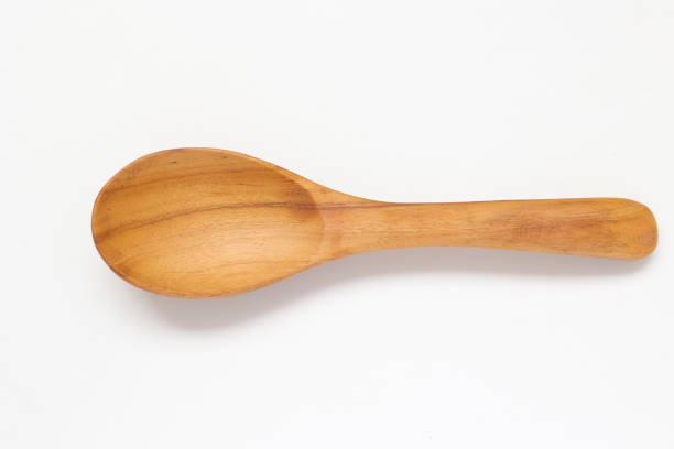 istock Wooden spoon on white background 2205630252