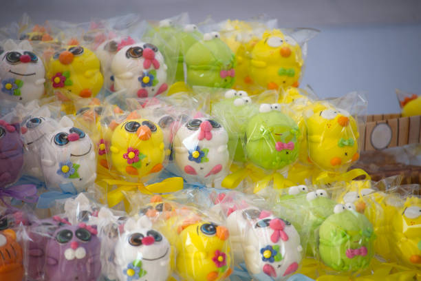 A close-up of colorful, wrapped cartoon-shaped candies, perfect for a delightful springtime treat or Easter celebration.