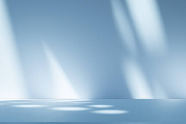 istock Studio style background wall decoration presentation uses white and blue tones. with shadows cast from a nearby window, concept creating a decorative 2205633095