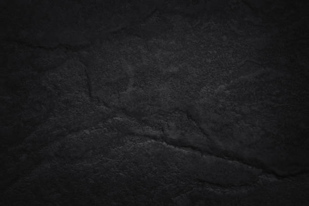 istock Dark gray black slate stone wall texture background in natural pattern for decorative interior and exterior. 2205634137