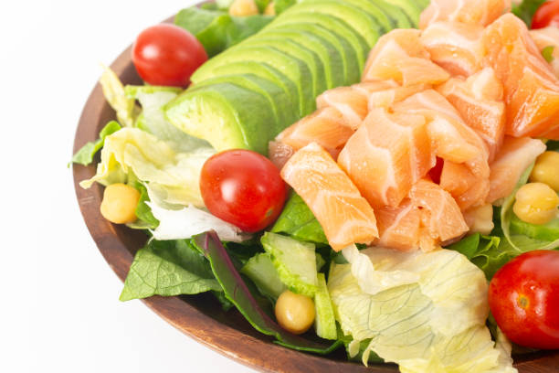 Salmon salad with scrambled eggs on the table in the restaurant.