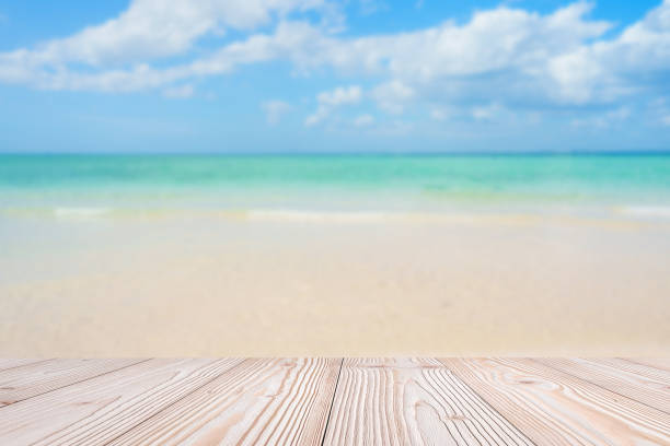 istock Empty wood table mockup with beautiful tropical beach background and copy space for text, Mock up for your product display and montage in summer season. vacation and wallpaper travel concepts 2205635513