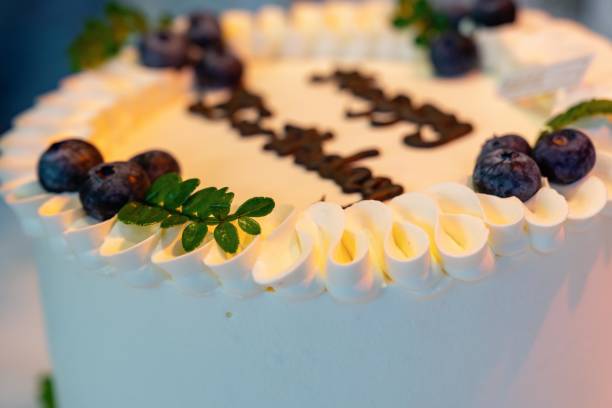 istock a cream birthday cake with blueberries 2205636141